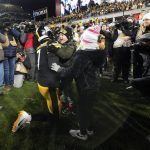 
              Pittsburgh Steelers quarterback Ben Roethlisberger (7) hugs his kids on the field after an NFL football game against the Cleveland Browns, Monday, Jan. 3, 2022, in Pittsburgh. The Steelers won 26-14. (AP Photo/Gene J. Puskar)
            