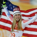 
              FILE - Silver medal winner Mikaela Shiffrin, of the United States, poses during the flower ceremony for the women's combined at the 2018 Winter Olympics in Jeongseon, South Korea, Feb. 22, 2018. Winter Olympians in outdoor sports such as Alpine skiing or snowboarding say the weather can be a key factor in success or failure. (AP Photo/Michael Probst, File)
            