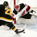 
              New Jersey Devils goaltender Mackenzie Blackwood (29) makes a save on a shot by Boston Bruins center Curtis Lazar (20) during the second period of an NHL hockey game Tuesday, Jan. 4, 2022, in Boston. (AP Photo/Charles Krupa)
            