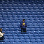 
              Spectators take their places in the stands ahead of the English Premier League soccer match between Chelsea and Liverpool at Stamford Bridge in London, Sunday, Jan. 2, 2022. (AP Photo/Matt Dunham)
            