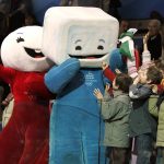 
              Children attending the short track skating races in the Palavela Arena cheer with Torino Olympic mascots Neve, left and Gliz at the 2006 Winter Olympics in Turin, Italy, Feb. 15, 2006. (AP Photo/Amy Sancetta)
            
