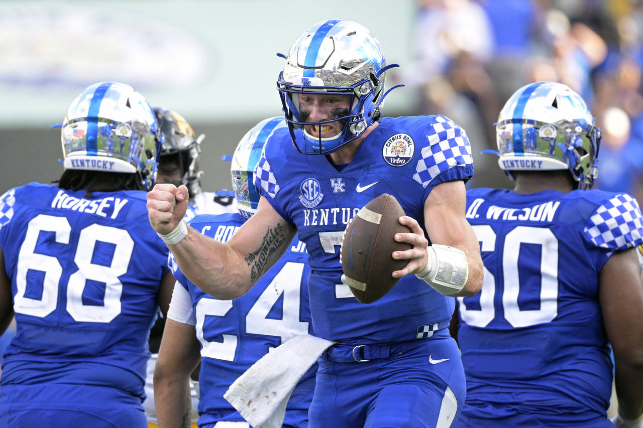 Kentucky quarterback Will Levis (7) celebrates after taking the final snap of the Citrus Bowl NCAA ...