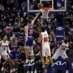 
              Golden State Warriors guard Stephen Curry (30) shoots against Detroit Pistons guard Cory Joseph (18) during the first half of an NBA basketball game in San Francisco, Tuesday, Jan. 18, 2022. (AP Photo/Jed Jacobsohn)
            