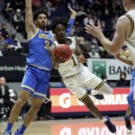 
              California guard Joel Brown (1) passes the ball against UCLA guard Johnny Juzang (3) during the first half of an NCAA college basketball game in Berkeley, Calif., Saturday, Jan. 8, 2022. (AP Photo/Jed Jacobsohn)
            