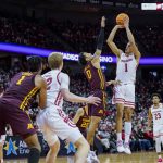 
              Wisconsin's Johnny Davis (1) shoots against Minnesota's Eric Curry (1) during the second half of an NCAA college basketball game Sunday, Jan. 30, 2022, in Madison, Wis. Wisconsin won 66-60. (AP Photo/Andy Manis)
            