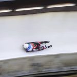 
              Trinity Ellis of Canada speeds in the ice track in the women's single-seater first run in the Luge World Cup in Winterberg, Germany, Sunday, Jan. 2, 2022. (Friso Gentsch/dpa via AP)
            