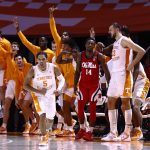 
              Tennessee guard Zakai Zeigler (5) and the bench react to his game-tying shot during an NCAA college basketball game against Mississippi on Wednesday, Jan. 5, 2022, in Knoxville, Tenn. Tennessee won 66-60 in overtime. (AP Photo/Wade Payne)
            