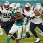 
              Miami Dolphins wide receiver Jaylen Waddle (17) runs with the ball during the second half of an NFL football game against the New England Patriots, Sunday, Jan. 9, 2022, in Miami Gardens, Fla. (AP Photo/Lynne Sladky)
            