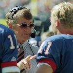 
              FILE - New York Giants head coach Dan Reeves gives some instructions to his starting quarterback Phil Simms during the third quarter of their game against the Tampa Bay Buccaneers at Giants Stadium in East Rutherford, N.J. on Sunday, Sept. 12, 1993.  Reeves, who won a Super Bowl as a player with the Dallas Cowboys but was best known for a long coaching career highlighted by four more appearances in the title game with the Denver Broncos and Atlanta Falcons, died Saturday, Jan. 1, 2022.  (AP Photo/Mark Lennihan, File)
            