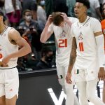 
              Miami guard Isaiah Wong (2), forward Sam Waardenburg (21) and guard Jordan Miller (11) walk off the court after an NCAA college basketball game against Florida State, Saturday, Jan. 22, 2022, in Coral Gables, Fla. Florida State won 61-60. (AP Photo/Lynne Sladky)
            