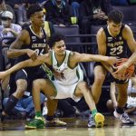 
              Colorado forward Tristan da Silva (23) steals the ball from Oregon guard Will Richardson (0) as Colorado guard Elijah Parquet (24) helps on the play during the second half of an NCAA college basketball game Tuesday, Jan. 25, 2022, in Eugene, Ore. (AP Photo/Andy Nelson)
            