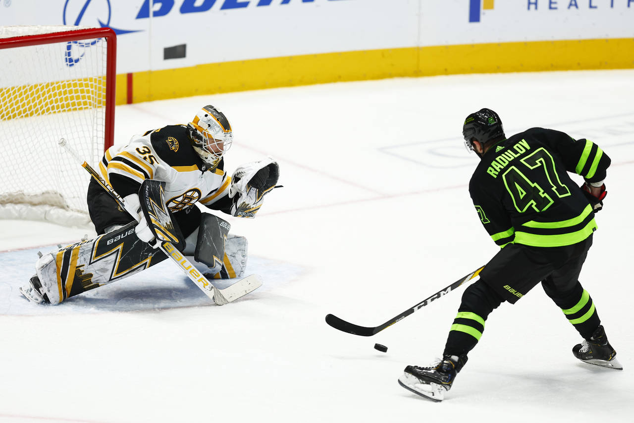 Dallas Stars forward Alexander Radulov (47) fakes out Boston Bruins goaltender Linus Ullmark (35) w...