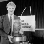 
              FILE - Boston Celtics' Larry Bird receives NBA's Most Valuable Player of the Year award during the NBA's award ceremony in San Francisco on June 23, 1985. (AP Photo/Paul Sakuma, File)
            