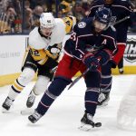 
              Columbus Blue Jackets forward Oliver Bjorkstrand, right, chases the puck in front of Pittsburgh Penguins forward Kasperi Kapanen during the first period of an NHL hockey game in Columbus, Ohio, Friday, Jan. 21, 2022. (AP Photo/Paul Vernon)
            