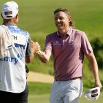 
              Cameron Smith celebrates with caddy Sam Pinfold after winning the final round of the Tournament of Champions golf event, Sunday, Jan. 9, 2022, at Kapalua Plantation Course in Kapalua, Hawaii. (AP Photo/Matt York)
            