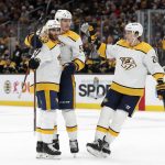 
              Nashville Predators' Luke Kunin (11) is congratulated by Philippe Myers and Matt Luff, right, after his goal against the Boston Bruins during the second period of an NHL hockey game Saturday, Jan. 15, 2022, in Boston. (AP Photo/Winslow Townson)
            