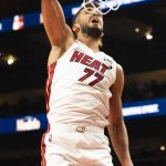 
              Miami Heat center Omer Yurtseven (77) dunks during the second half of an NBA basketball game against the Atlanta Hawks, Friday, Jan. 21, 2022, in Atlanta. (AP Photo/Hakim Wright Sr.)
            