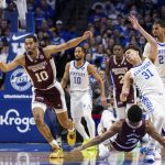 
              Mississippi State forward Garrison Brooks (10) chases after a loose ball while guard Shakeel Moore (3) and Kentucky guard Kellan Grady (31) fall to the ground during the first half of an NCAA college basketball game in Lexington, Ky., Tuesday, Jan. 25, 2022. (AP Photo/Michael Clubb)
            