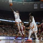 
              Texas guard Andrew Jones (1) scores against Oklahoma during the second half of an NCAA college basketball game, Tuesday, Jan. 11, 2022, in Austin, Texas. (AP Photo/Eric Gay)
            