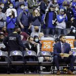 
              Seton Hall assistant coach Marcus Mathews sits on an empty bench during the first half of an NCAA college basketball game against Villanova on Saturday, Jan. 1, 2022, in Newark, N.J. Seton Hall played the game with 8 players. (AP Photo/Adam Hunger)
            