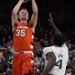 
              Syracuse guard Buddy Boeheim (35) goes up for a shot against Miami guard Bensley Joseph (4) during the first half of an NCAA college basketball game, Wednesday, Jan. 5, 2022, in Coral Gables, Fla. (AP Photo/Wilfredo Lee)
            