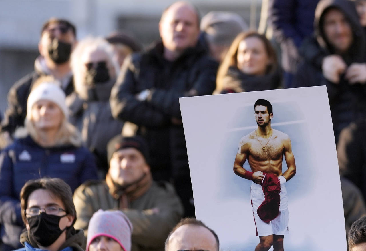 Supporters of Serbia's Novak Djokovic protest in Belgrade, Serbia, Friday, Jan. 7, 2022. Several hu...
