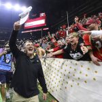 
              Georgia head coach Kirby Smart celebrates with fans after beating Alabama 33-18 in the College Football Playoff championship game, early Tuesday, Jan. 11, 2022, in Indianapolis. (Curtis Compton/Atlanta Journal-Constitution via AP)
            