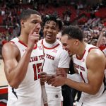 
              Texas Tech's Kevin McCullar (15), Terrence Shannon Jr. (1), and Marcus Santos-Silva (14) celebrate after the second half of an NCAA college basketball game against West Virginia, Saturday, Jan. 22, 2022, in Lubbock, Texas. (AP Photo/Brad Tollefson)
            