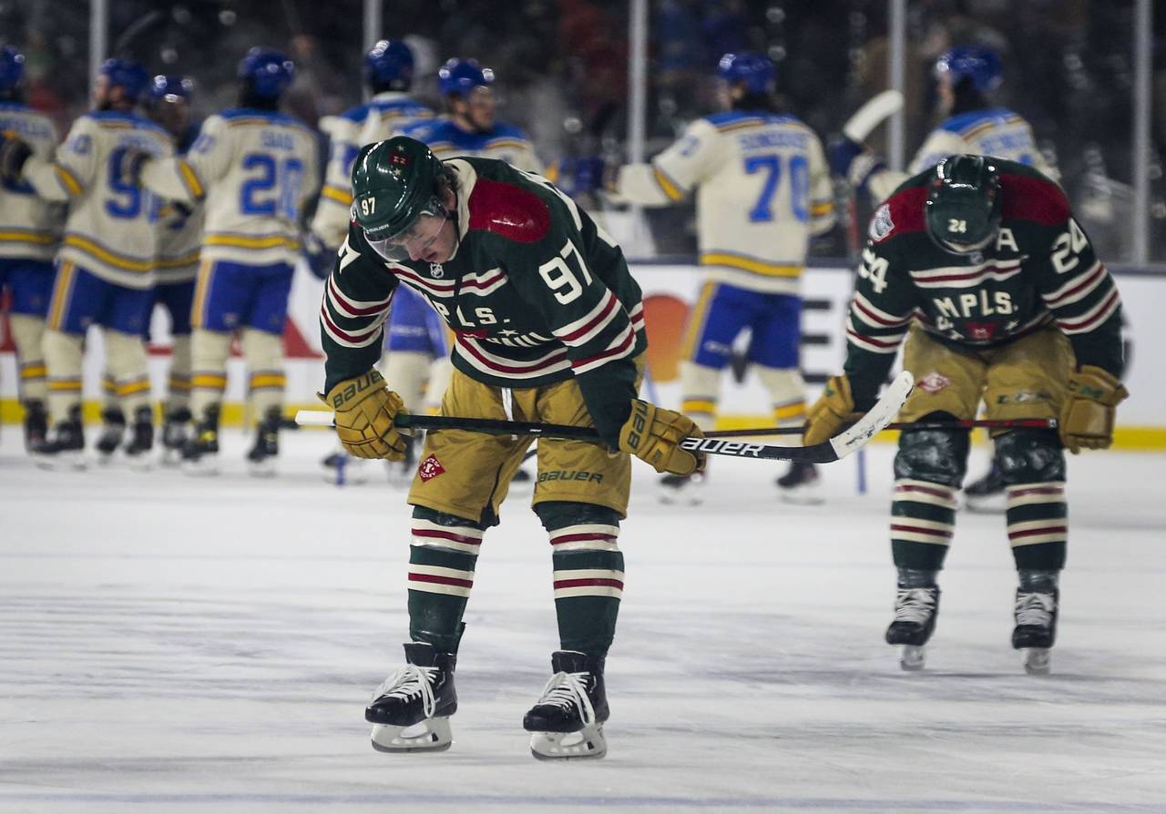Minnesota Wild left wing Kirill Kaprizov (97) and defenseman Matt Dumba (24) skate off the ice as S...