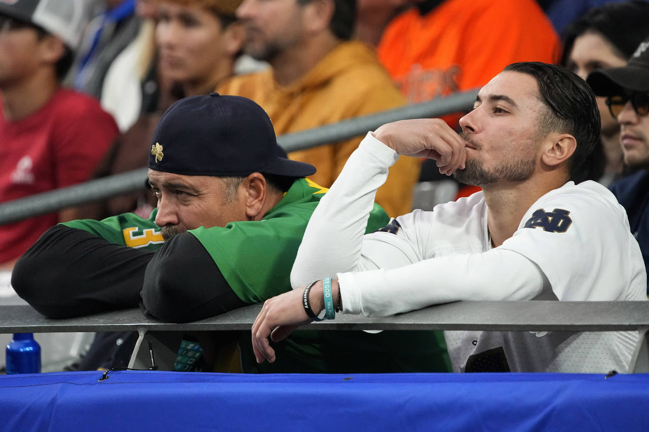 Notre Dame fans watch during the second half of the Fiesta Bowl NCAA college football game against ...