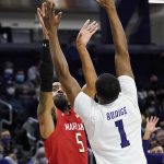 
              Maryland guard Eric Ayala, left, shoots over Northwestern guard Chase Audige during the first half of an NCAA college basketball game in Evanston, Ill., Wednesday, Jan. 12, 2022. (AP Photo/Nam Y. Huh)
            