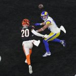 
              Los Angeles Rams wide receiver Cooper Kupp (10) eyes a touchdown pass in the end zone as Cincinnati Bengals cornerback Eli Apple (20) attempts to tackle during the second half of the NFL Super Bowl 56 football game, Sunday, Feb. 13, 2022, in Inglewood, Calif. (AP Photo/Matt Rourke)
            