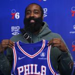 
              Philadelphia 76ers' James Harden holds up his new jersey after taking questions from the media at a press conference at the NBA basketball team's facility, Tuesday, Feb. 15, 2022, in Camden, N.J. (AP Photo/Chris Szagola)
            