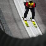 
              Karl Geiger, of Germany, speeds down the hill during a men's large hill individual trial round for competition at the 2022 Winter Olympics, Saturday, Feb. 12, 2022, in Zhangjiakou, China. (AP Photo/Andrew Medichini)
            