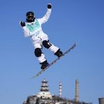 
              Lucile Lefevre of France competes during the women's snowboard big air qualifications of the 2022 Winter Olympics, Monday, Feb. 14, 2022, in Beijing. (AP Photo/Ashley Landis)
            