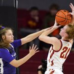 
              Iowa State guard Lexi Donarski (21) is fouled by Kansas State guard Rebekah Dallinger, left, during the second half of an NCAA college basketball game, Wednesday, Feb. 2, 2022, in Ames, Iowa. Iowa State won 70-55. (AP Photo/Charlie Neibergall)
            