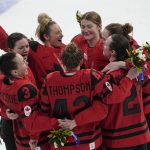 
              Canada celebrates their gold medal after defeating the United States during the women's gold medal hockey game at the 2022 Winter Olympics, Thursday, Feb. 17, 2022, in Beijing. (AP Photo/Jae C. Hong)
            