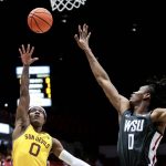 Arizona State guard DJ Horne (0) shoots the ball as Washington State forward Efe Abogidi (0) defends in the first half of an NCAA college basketball game Saturday, Feb. 12, 2022, in Pullman, Wash. (AP Photo/August Frank)
