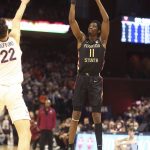 
              Florida State center Tanor Ngom (11) shoots over Virginia center Francisco Caffaro (22) during an NCAA college basketball game in Charlottesville, Va., Saturday, Feb. 26, 2022. (AP Photo/Andrew Shurtleff)
            