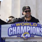 
              Los Angeles Rams quarterback Matthew Stafford holds up a bottle during the team's victory celebration and parade in Los Angeles, Wednesday, Feb. 16, 2022, following the Rams' win Sunday over the Cincinnati Bengals in the NFL Super Bowl 56 football game. (AP Photo/Marcio Jose Sanchez)
            