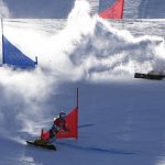 
              Netherlands' Michelle Dekker crashes as Czech Republic's Ester Ledecka advances during the women's parallel giant slalom finals at the 2022 Winter Olympics, Tuesday, Feb. 8, 2022, in Zhangjiakou, China. (AP Photo/Gregory Bull)
            