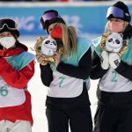 
              Bronze medalist, from left, Kokomo Murase of Japan, gold medalist Anna Gasser of Austria, and silver medalist Zoi Sadowski Synnott of New Zealand, pose during a venue ceremony for the women's snowboard big air finals of the 2022 Winter Olympics, Tuesday, Feb. 15, 2022, in Beijing. (AP Photo/Jae C. Hong)
            