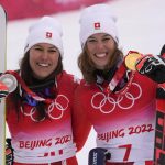
              Wendy Holdener of Switzerland, silver, left, and Michelle Gisin of Switzerland, gold, celebrate after the medal ceremony for the women's combined at the 2022 Winter Olympics, Thursday, Feb. 17, 2022, in the Yanqing district of Beijing. (AP Photo/Luca Bruno)
            
