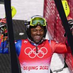 
              Richardson Viano, of Haiti, celebrates after finishing the men's slalom run 2 at the 2022 Winter Olympics, Wednesday, Feb. 16, 2022, in the Yanqing district of Beijing. Haiti sent skier Richardson Viano to China as its first winter Olympian ever. Like Viano, who learned to ski in France after he was adopted by a French family, most of the African and Caribbean participants in the Games either trained or lived in countries with ski slopes and training facilities. (AP Photo/Pavel Golovkin)
            