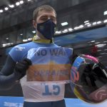 
              FILE - In this frame from video, Vladyslav Heraskevych, of Ukraine, holds a sign that reads "No War in Ukraine" after finishing a run at the men's skeleton competition at the 2022 Winter Olympics, Friday, Feb. 11, 2022, in the Yanqing district of Beijing. (NBC via AP, File)
            