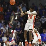 
              Florida guard Tyree Appleby (22) passes the ball past Arkansas guard Chris Lykes (11) during the first half of an NCAA college basketball game Tuesday, Feb. 22, 2022, in Gainesville, Fla. (AP Photo/Matt Stamey)
            