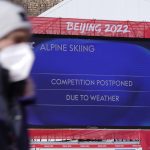 
              The board in the finish area shows that the men's downhill was postponed due to weather at the 2022 Winter Olympics, Sunday, Feb. 6, 2022, in the Yanqing district of Beijing. (AP Photo/Robert F. Bukaty)
            