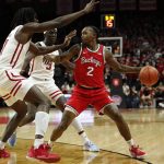 
              Rutgers center Clifford Omoruyi, left, and forward Mawot Mag defend against Ohio State guard Cedric Russell (2) during the half of an NCAA college basketball game in Piscataway, N.J., Wednesday, Feb. 9, 2022. (AP Photo/Noah K. Murray)
            