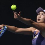 
              FILE - China's Peng Shuai serves to Japan's Nao Hibino during their first round singles match at the Australian Open tennis championship in Melbourne, Australia, on Jan. 21, 2020. The controversy surrounding Chinese tennis star Peng Shuai’s accusations of sexual assault against a former top politician continues to cast a shadow of the Beijing Winter Olympic Games that officially begin on Friday, Feb. 4. 2022. Peng disappeared from public view in November, 2021, after accusing former Communist Party official Zhang Gaoli of sexual assault. (AP Photo/Andy Brownbill, File)
            