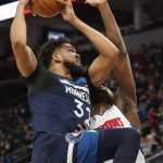 
              Minnesota Timberwolves center Karl-Anthony Towns (32) goes to the basket against Detroit Pistons center Isaiah Stewart in the first quarter of an NBA basketball game, Sunday, Feb. 6, 2022, in Minneapolis. (AP Photo/Bruce Kluckhohn)
            